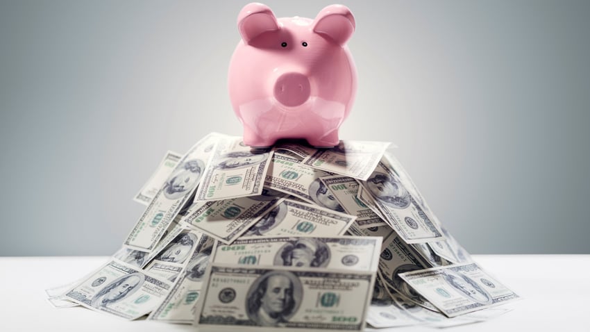 pile of cash, piggy bank, money, cash, dollars, bills, spend