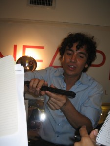 Lead stylist Ashley Javier demonstrates how he used Linea Pro's flat iron at Behnaz Sarafpour.