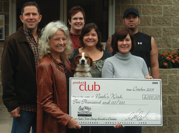 Product Club employees present a $2,000 donation check to Noah's Wish.