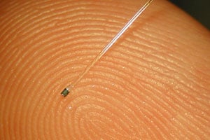 Figure 1. A photo of the sensor resting on a fingertip to show scale 