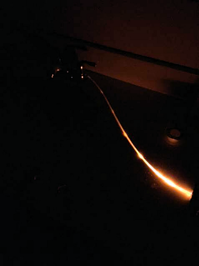 Fig.4: Photograph of continuous emission from a section of the fiber resulting from added scratches between measurement points.