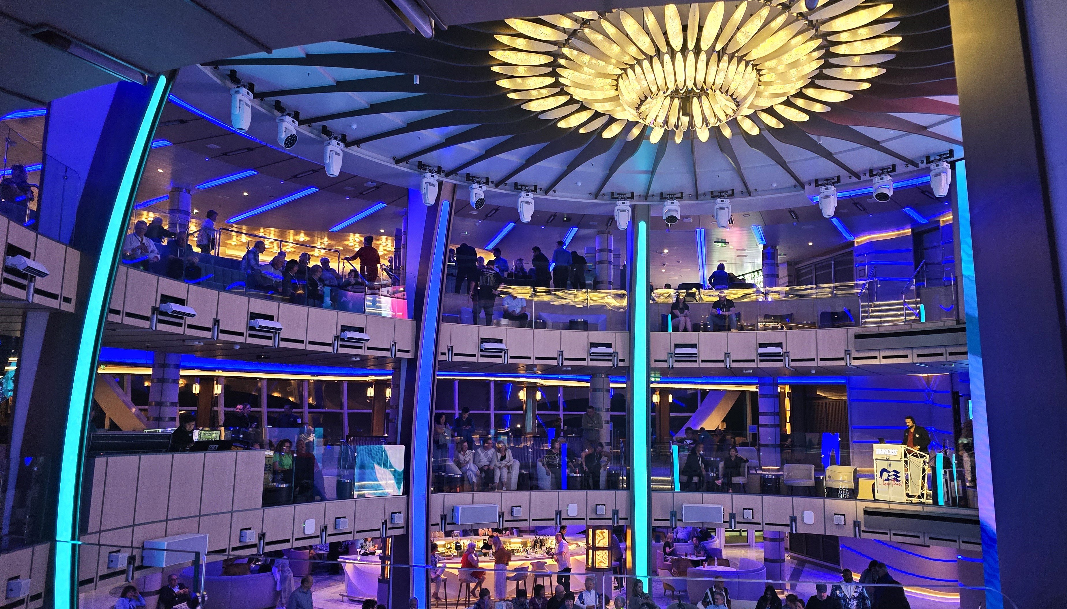 Sun Princess Piazza is on multiple levels with seating bars eateries and live entertainment below on Deck 7 Photo by Susa