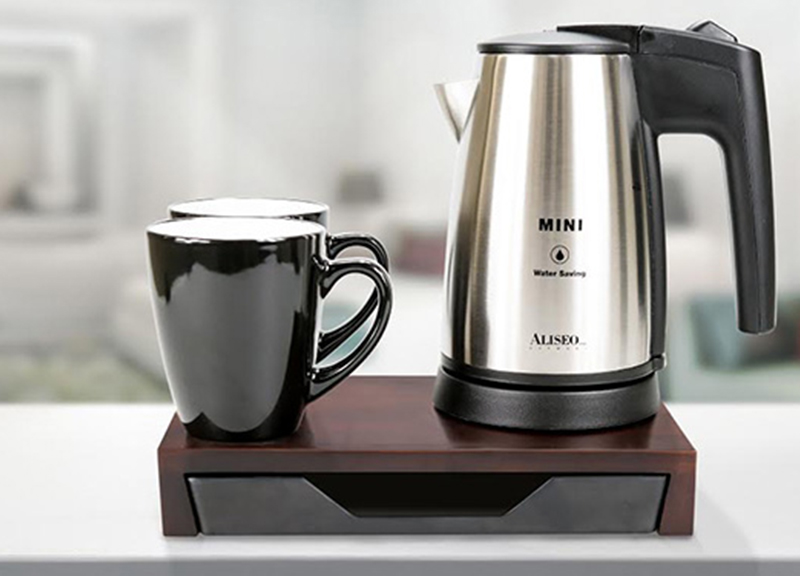 Designed by Winfried Noth the set includes a tray a 500-ml cordless mini kettle and ceramic mugs