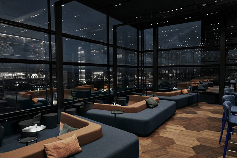 Snhetta also designed all fixed furniture including the bar glass shelf couches and tables rails and signage 