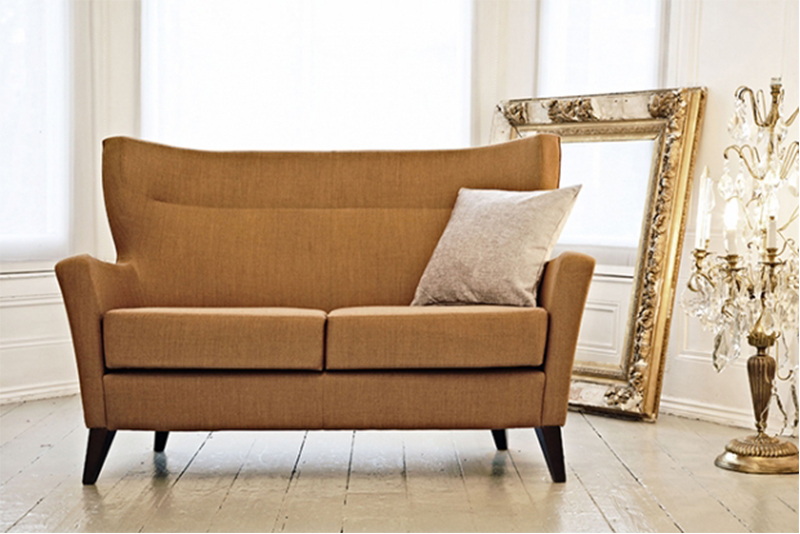 Jenny is available in six different wood finishes and a variety of fabrics and faux leathers