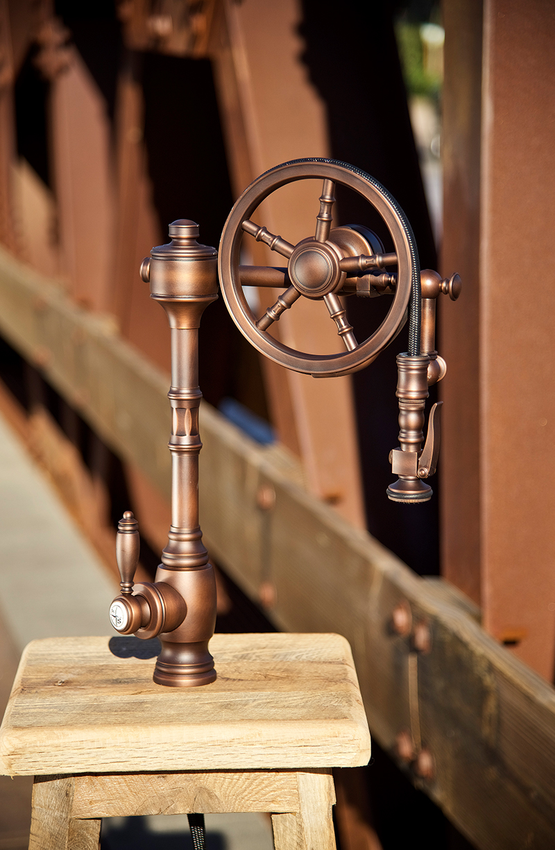 The Wheel a pull-down kitchen faucet with a large wheel with five spokes is made of solid brass