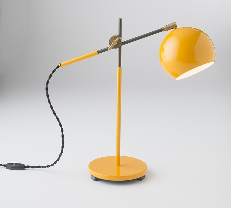 Studio features a globose shade cast iron base and twisted cloth cord