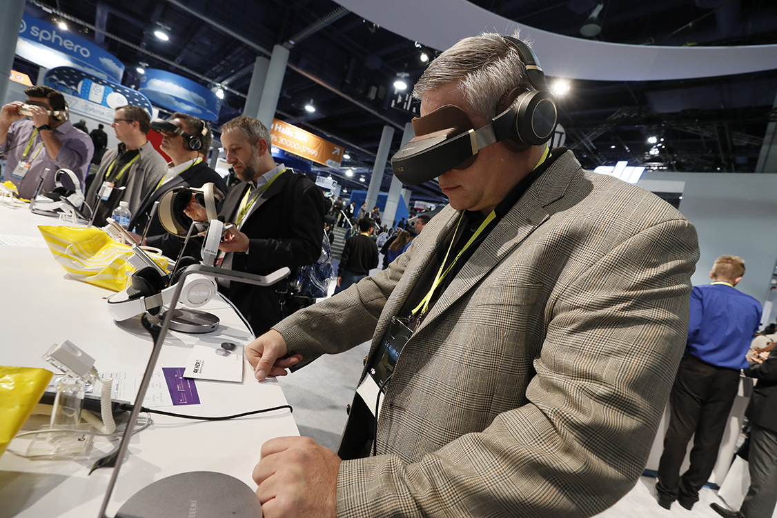 A CES attendee tries VR