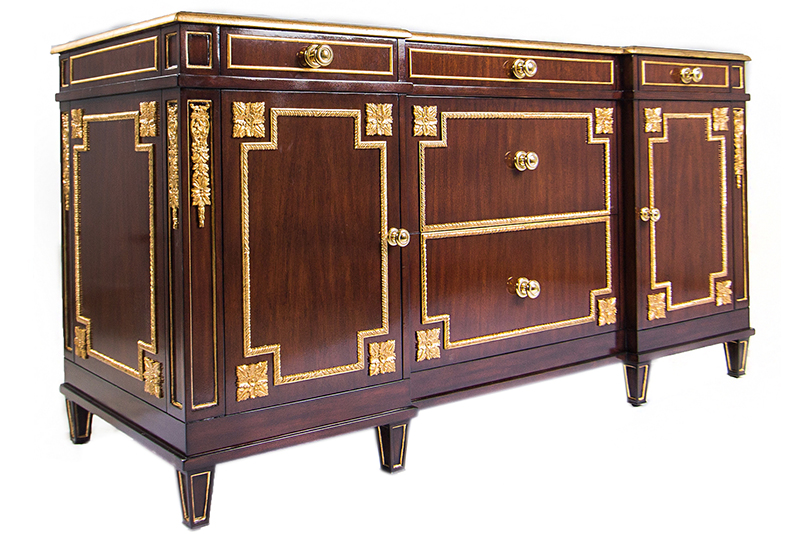 The cabinet is a versatile piece with room for a minibar glasses and a coffee maker in its felt-lined drawers