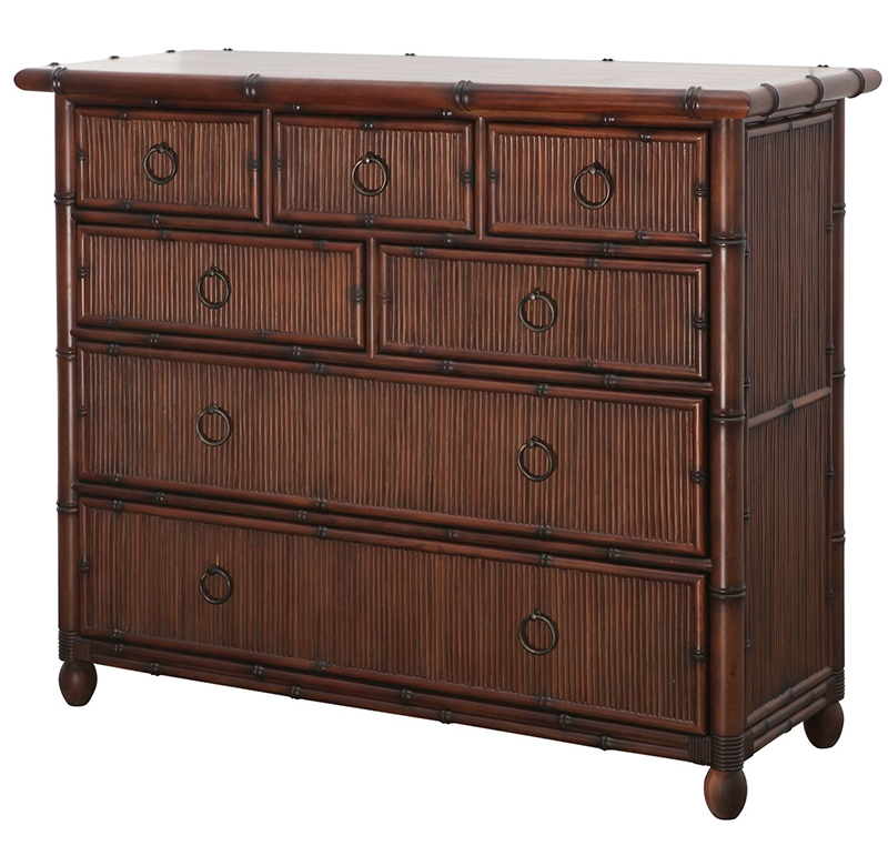 The Chest of Drawers has a wooden frame with a rattan reed faade 