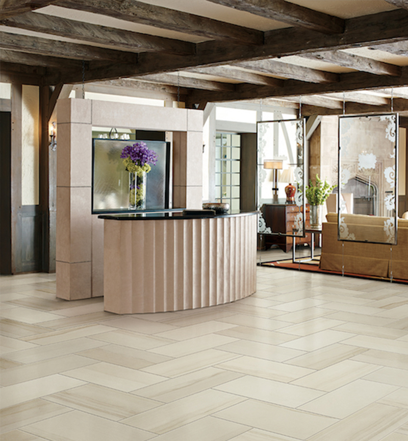 Made of porcelain stone the collection resembles lunar rock formations thanks to both its sandstone-like texture and multi-