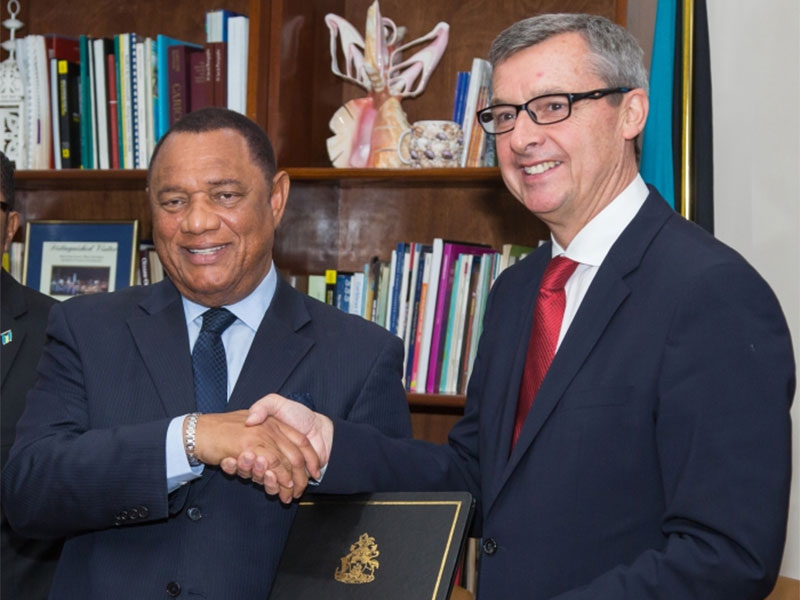 At a signing ceremony attended by Perry Christie Prime Minister of The Bahamas left and Michael Bayley president and CEO