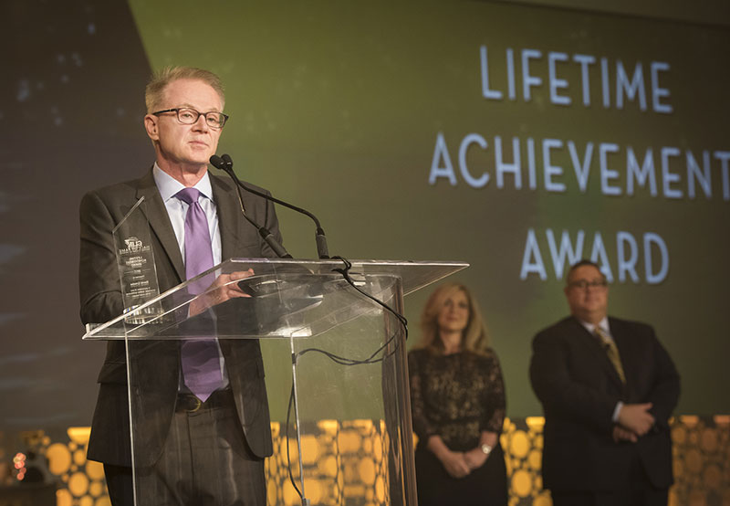 David Crooks accepts a Lifetime Achievement Award at CLIAs Cruise360 conference