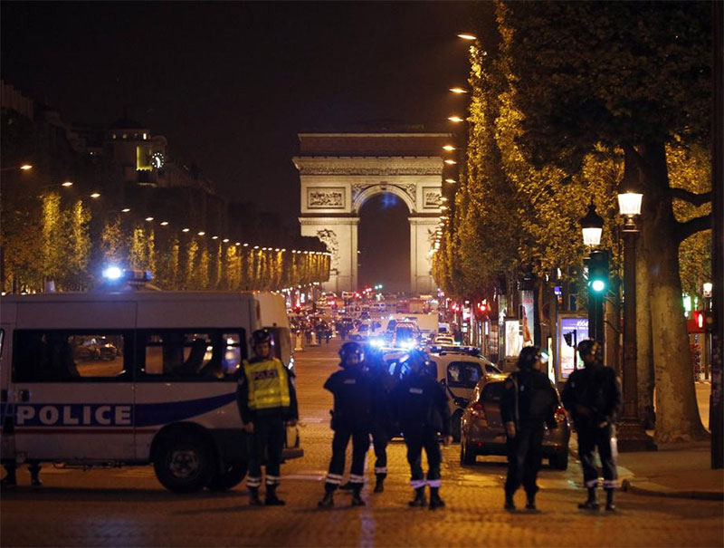 Police seal off the Champs Elysees avenue in Paris France after a fatal shooting in which a police officer was killed along