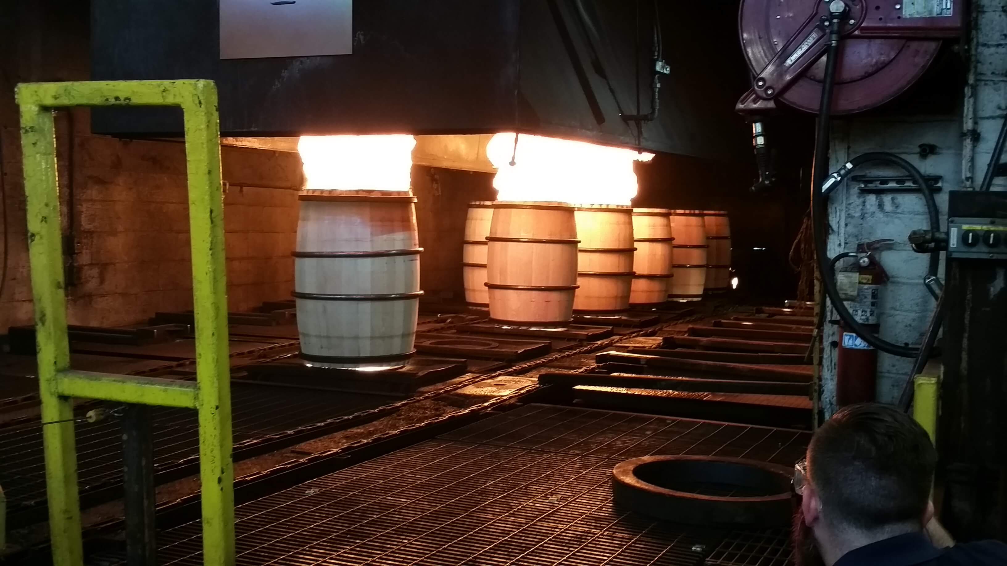 Bourbon barrels being charred