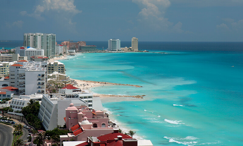 A view of the beach and hotels in Cancun