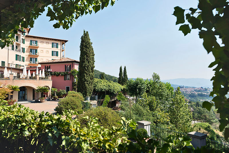 The outdoor patio at Renaissance Tuscany Il Ciocco Resort  Spa