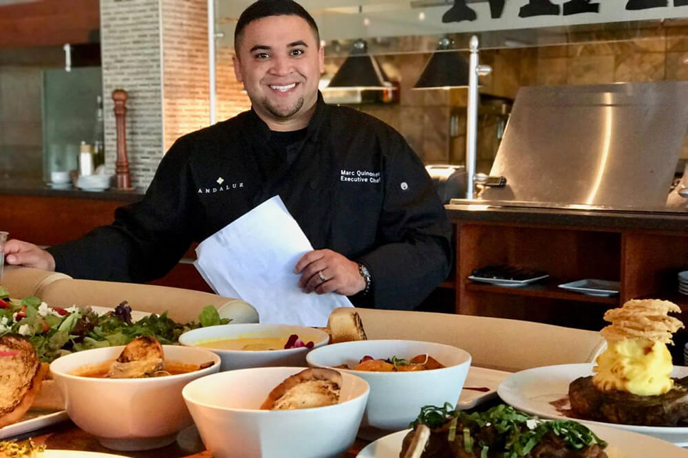 chef with food on plates