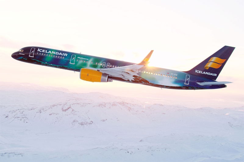 Icelandair airplane flying over snow