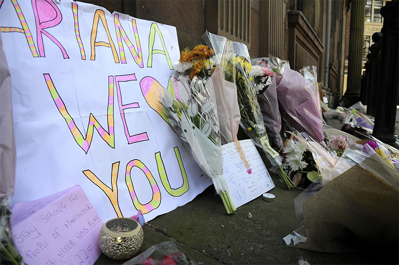 Flower tributes at St Anns square Manchester England