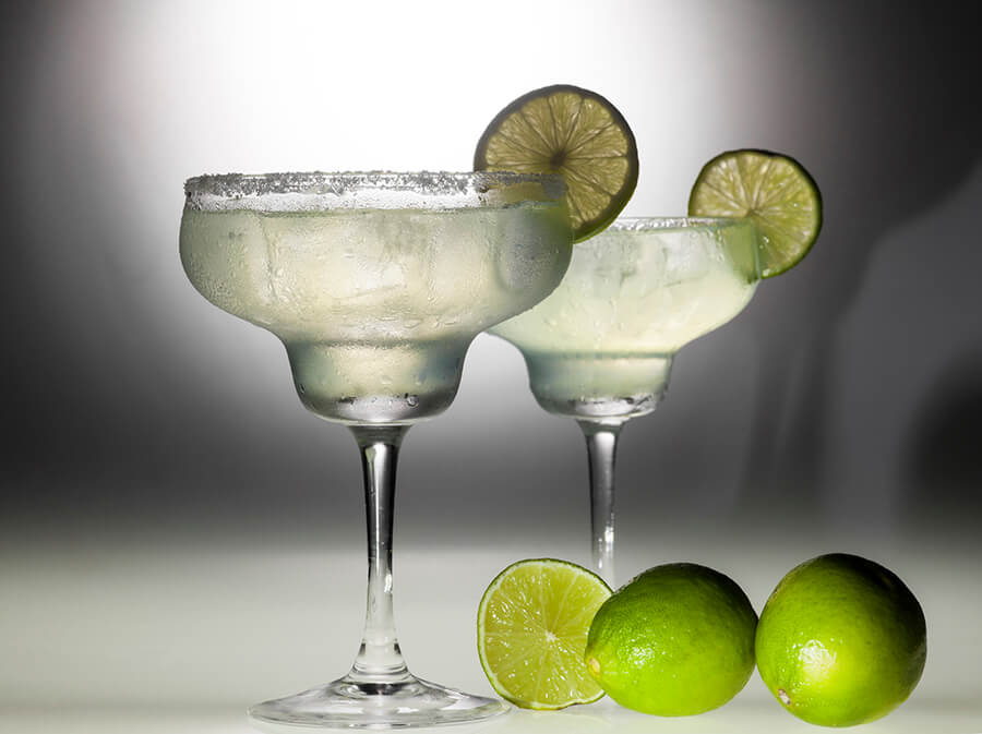 glasses with alcohol and limes