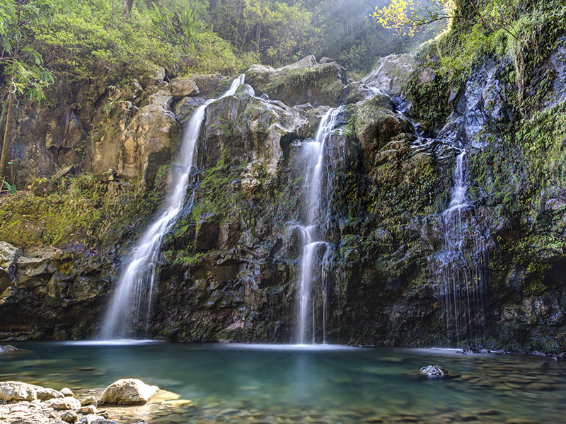 Tripple Waterfall called Upper Waikuni Falls or Three Bear Falls of the Wailua Nui Stream along the Road to Hana on Maui Isla