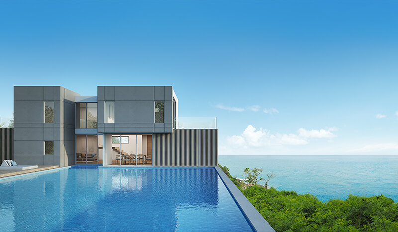 modern house and pool overlooking the sea