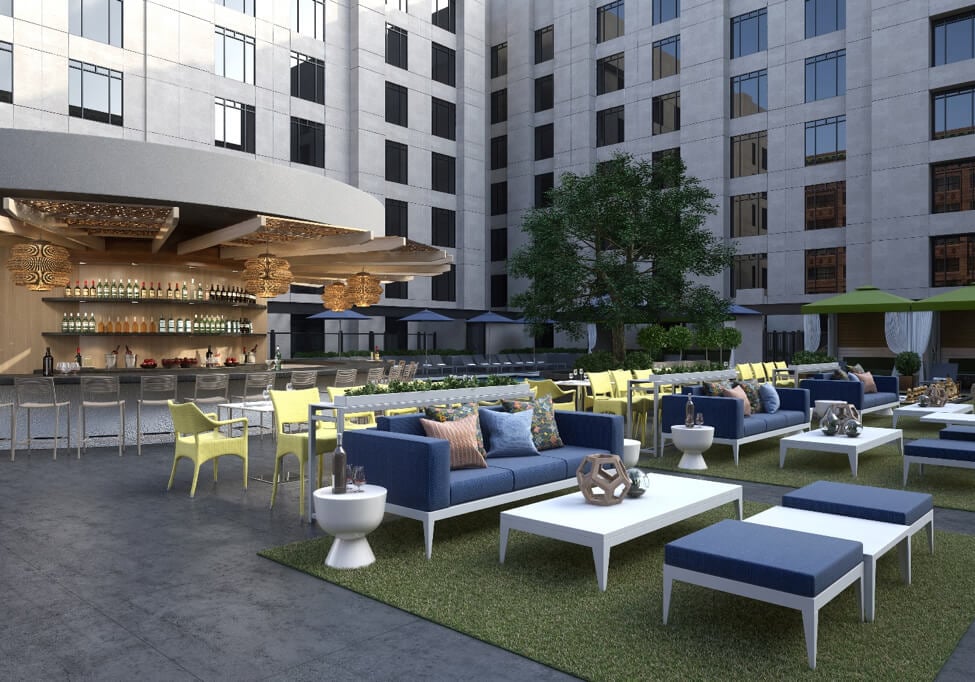 tables and chairs near a bar on a rooftop