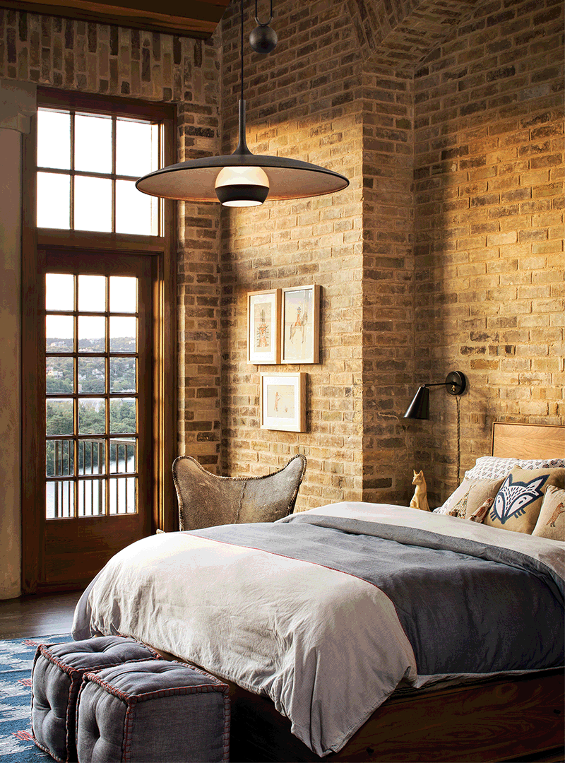 The suspended pendant is counterbalanced by a weighted wrought iron sphere which allows for the adjustment of the height of 