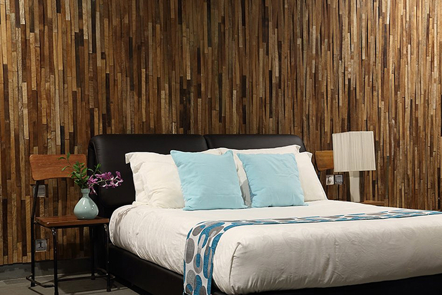 Kayu V-wood wall cladding is a meshed tile arrangement of reclaimed Indonesian teak with a tapering relief 