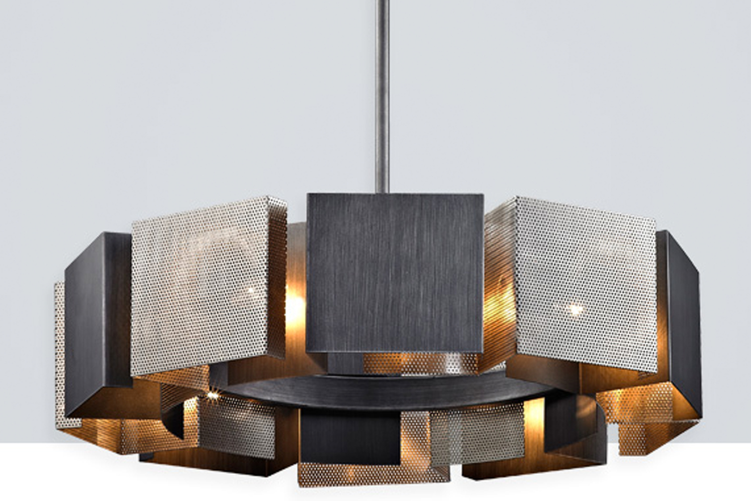 Impression by Troy Lighting is a modernist centerpiece comprised of perforated handworked iron squares 