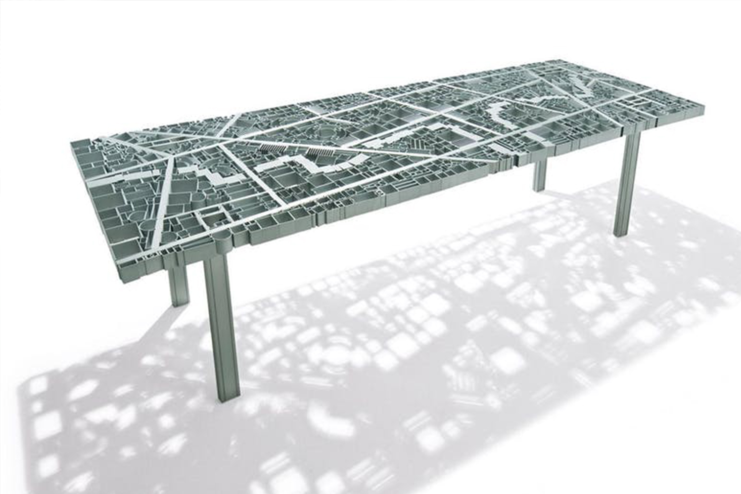 Edra launched Baghdad a manually welded anodized aluminum table in the form of a city map 