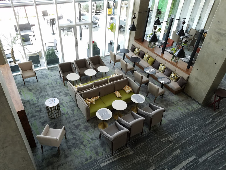 The two-story lobby of the Homewood Suites Silao has a full bar and restaurant