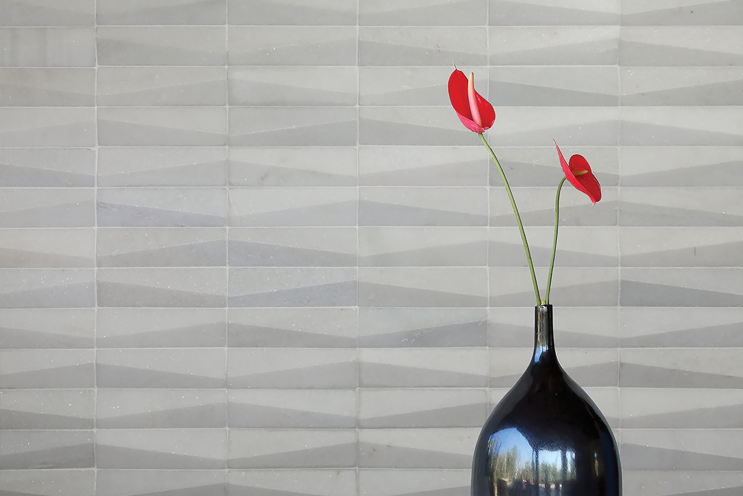 Island Stone introduced the Dunes series of subway tiles which were sculpted with an offset angled surface forming a flow o