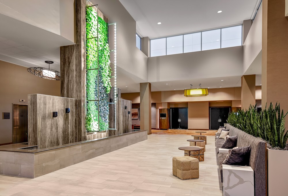 The lobby of the Embassy Suites by Hilton Jonesboro Red Wolf Convention Center is outfitted with nature-inspired artwork