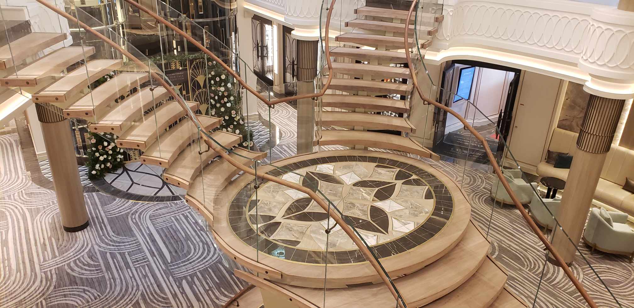 The grand atrium staircase of Seven Seas Grandeur a Regent Seven Seas Cruises new Explorer-class ship
