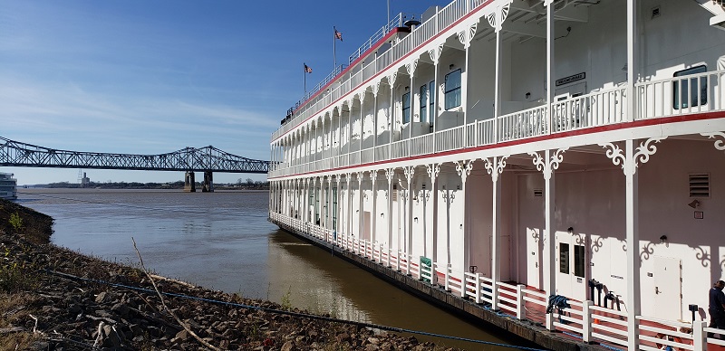 American Queen Voyages  Duchess is shown at a Mississippi River port