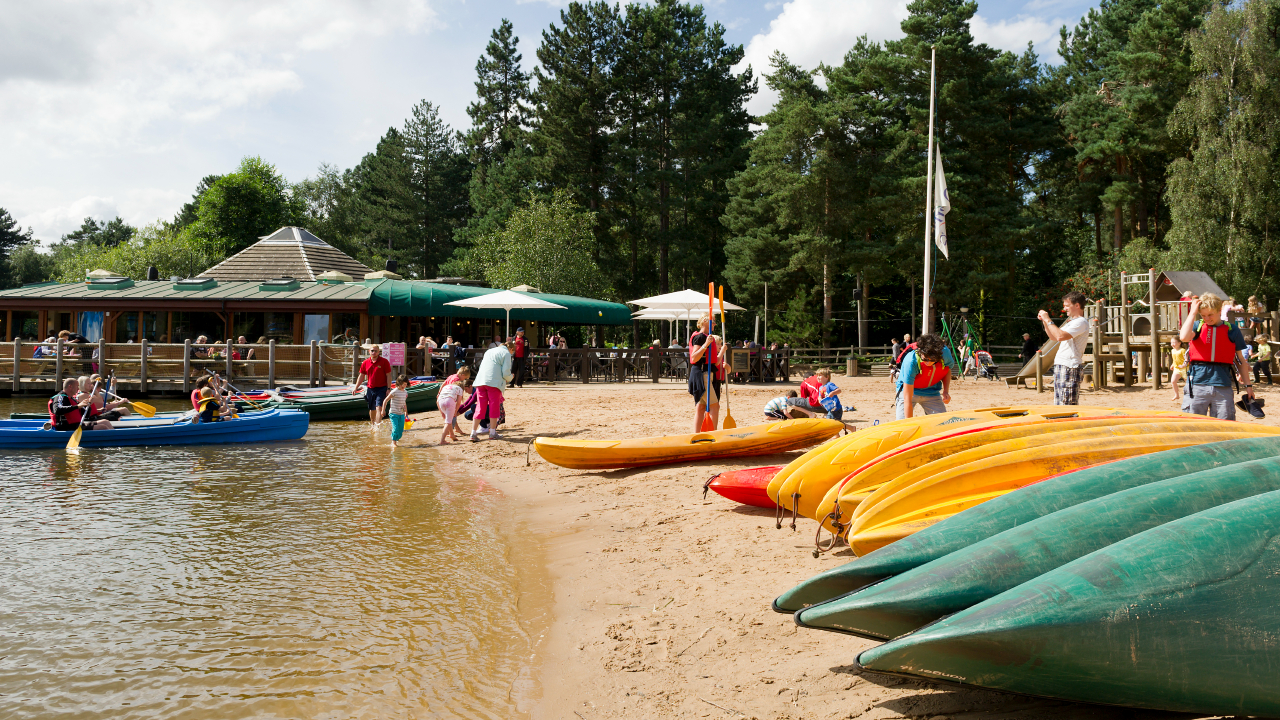 Families on a beach at the Sherwood Forest Center Parcs