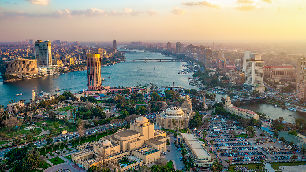 An aerial of Cairo with the Nile running through the center of the city