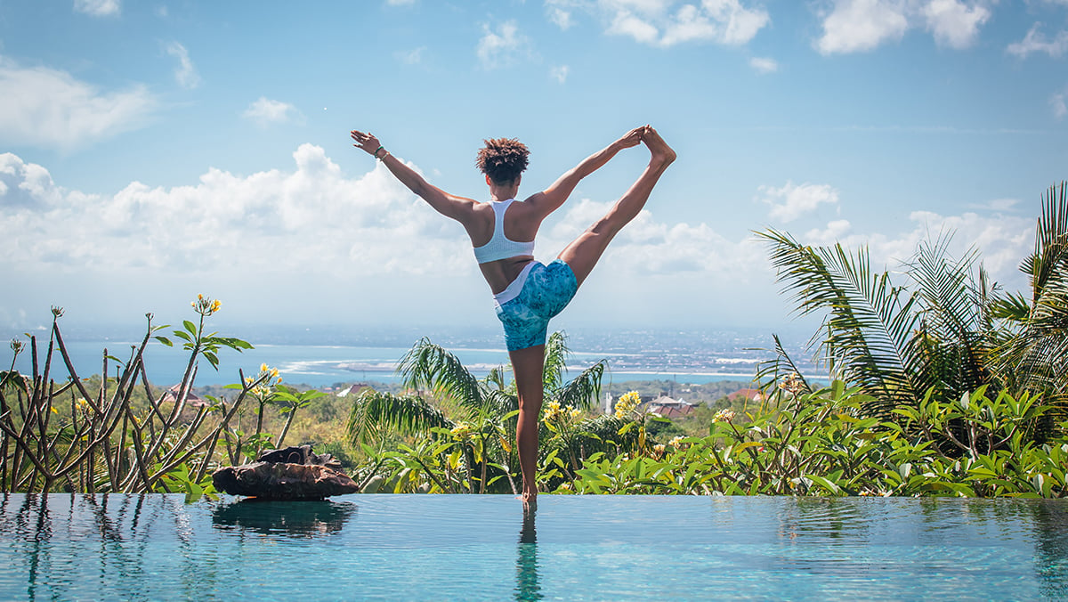 Young woman doing yoga pose in Bali