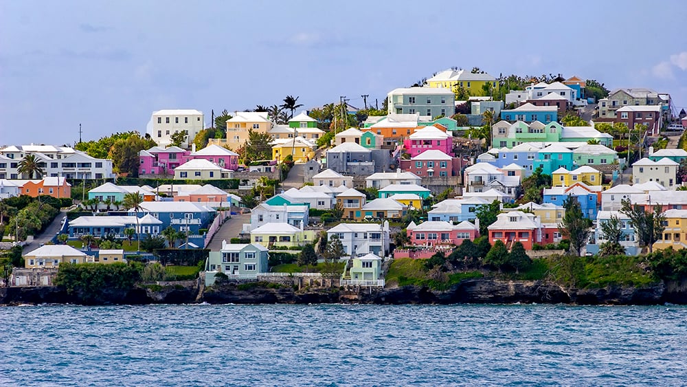 pastel houses on a hill in Hamilton Bermuda overlooking the water
