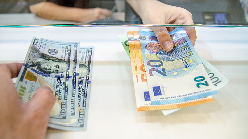 exchanging dollars for euros at a counter