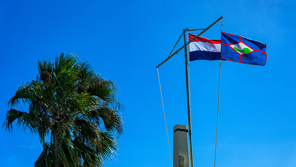 St Eustastius Flag and Dutch Flag hanging in Fort Oranje
