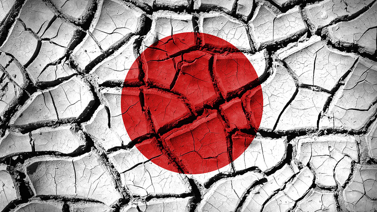 Japan flag on cracked earth texture