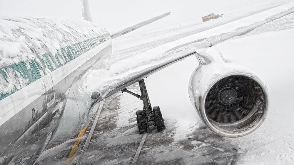 airline on the ground in the snow