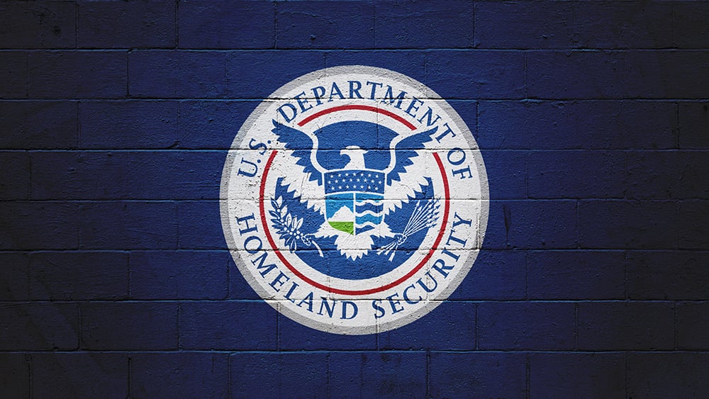US Department of Homeland Security seal on a blue brick background