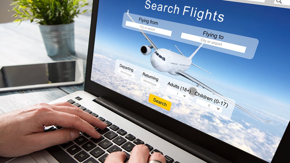 Search flight booking window on a laptop