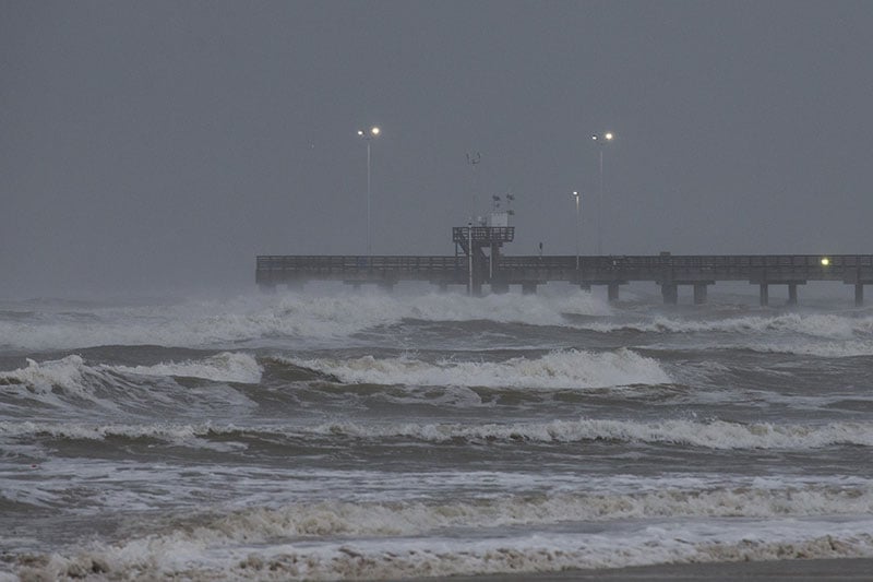 Surf rises at Bob Hall Pier Corpus Christi Texas as Hurricane Harvey approaches
