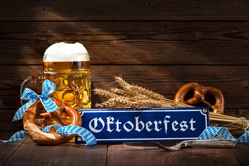Oktoberfest sign with beer and pretzels