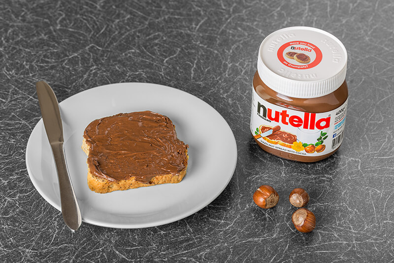toast with nutella jar next to it
